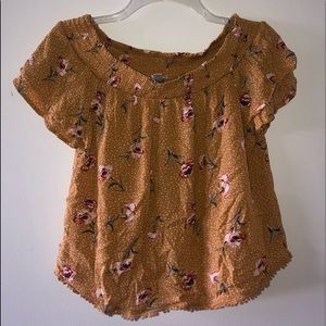 yellow flowy top with flower detailing
